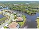 Expansive aerial capture of waterfront residences boasting private docks and waterway access at 8774 Mystic Cir, North Port, FL 34287