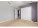Cozy bedroom with a walk-in closet and neutral carpet at 8774 Mystic Cir, North Port, FL 34287