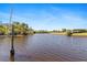 Scenic view of canal waterfront property, offering serene water views and boating opportunities at 8774 Mystic Cir, North Port, FL 34287