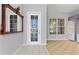 Inviting foyer featuring an decorative glass door and tile floors, adding character to the home's entrance at 8774 Mystic Cir, North Port, FL 34287