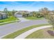 Lovely home featuring lush landscaping, a paved driveway, and well-kept lawn on a quiet street at 8774 Mystic Cir, North Port, FL 34287