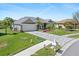 Charming single-Gathering home featuring a paved driveway, manicured lawn, and attached garage at 8774 Mystic Cir, North Port, FL 34287