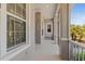 Charming screened-in front porch featuring neutral decor, offering a tranquil space to unwind at 8774 Mystic Cir, North Port, FL 34287