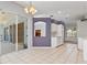 Open-concept living area with easy access to the patio and other rooms at 8774 Mystic Cir, North Port, FL 34287