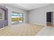 Bright living room with sliding glass doors leading to the pool area, allowing for ample natural light at 8774 Mystic Cir, North Port, FL 34287