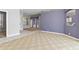 Open living space highlighting natural light, neutral tones, and doorways into adjoining areas at 8774 Mystic Cir, North Port, FL 34287