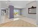 Open living space with tile flooring and sliding glass doors opening to screened lanai at 8774 Mystic Cir, North Port, FL 34287