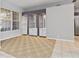 Living room featuring custom built-ins, window, and neutral paint palette at 8774 Mystic Cir, North Port, FL 34287
