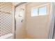 Shower with window and decorative tile at 8774 Mystic Cir, North Port, FL 34287