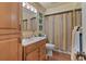 Well-lit bathroom equipped with a vanity, mirror, and a shower-tub combination, for convenience at 1060 Venetian Pkwy, Venice, FL 34285