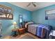 Neutral bedroom with ceiling fan, window and tiled flooring at 1060 Venetian Pkwy, Venice, FL 34285