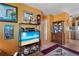 Inviting living room featuring tile floors, bright walls and display cabinet, creating a warm atmosphere at 1060 Venetian Pkwy, Venice, FL 34285