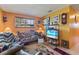 Cozy living room with tile flooring, plenty of seating, and a large window providing natural light at 1060 Venetian Pkwy, Venice, FL 34285