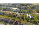 Drone shot of neighborhood highlighting the property and community amenities at 121 Long Meadow Ln, Rotonda West, FL 33947