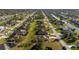 Overhead view of the residential neighborhood featuring canals and well-maintained landscaping at 121 Long Meadow Ln, Rotonda West, FL 33947