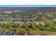 Aerial image showcasing the neighborhood with canals and lush greenery at 121 Long Meadow Ln, Rotonda West, FL 33947
