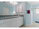 Well-lit bathroom with modern fixtures and ample storage at 121 Long Meadow Ln, Rotonda West, FL 33947