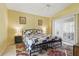 Main bedroom featuring a large bed, two side tables with lamps and a sliding glass door at 121 Long Meadow Ln, Rotonda West, FL 33947