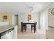 This eat-in kitchen is adjacent to the dining area and includes a stainless dishwasher at 121 Long Meadow Ln, Rotonda West, FL 33947