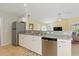 The kitchen offers plenty of counter and cabinet space with stainless appliances and a convenient layout at 121 Long Meadow Ln, Rotonda West, FL 33947