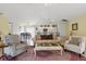 Open-concept living area with a view of the kitchen and dining area, perfect for entertaining at 121 Long Meadow Ln, Rotonda West, FL 33947