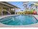 Inviting screened-in pool area, perfect for relaxation and outdoor entertaining at 121 Long Meadow Ln, Rotonda West, FL 33947