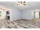 Bright living room featuring new flooring and stylish ceiling fan at 1341 Preston St, Port Charlotte, FL 33952