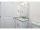Bright bathroom with granite vanity and updated fixtures at 1384 Alpinia Rd, North Port, FL 34288