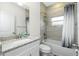 Updated bathroom featuring shower-tub, granite vanity, and modern fixtures at 1384 Alpinia Rd, North Port, FL 34288