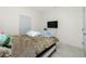 Bedroom featuring tile floors and a mounted TV at 1384 Alpinia Rd, North Port, FL 34288