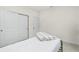 This bedroom features white walls, and large closet doors at 1384 Alpinia Rd, North Port, FL 34288