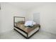 This cozy bedroom has tile flooring at 1384 Alpinia Rd, North Port, FL 34288