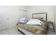 Cozy bedroom featuring a plush bed and a neutral color palette, as well as two doors at 1384 Alpinia Rd, North Port, FL 34288