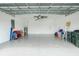 Large garage with overhead storage and a clean, epoxy floor at 1384 Alpinia Rd, North Port, FL 34288