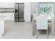 Bright kitchen and dining area with stainless steel appliances and a modern dining table at 1384 Alpinia Rd, North Port, FL 34288