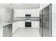 Well-equipped kitchen with stainless steel appliances, granite countertops, and ample cabinet space at 1384 Alpinia Rd, North Port, FL 34288