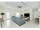 The living room features contemporary furniture, ample seating, and an open-concept layout at 1384 Alpinia Rd, North Port, FL 34288