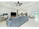 Open-concept living area flows into a modern kitchen and dining space with ample seating at 1384 Alpinia Rd, North Port, FL 34288