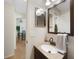 Bathroom featuring a vanity, single sink, and a view into other rooms at 1406 Woodcrest, North Port, FL 34286