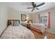 Bedroom with two twin beds, stylish decor, and a window view at 1406 Woodcrest, North Port, FL 34286