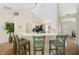 Bright kitchen featuring a breakfast bar, a vaulted ceiling, and seamless transition to adjacent living spaces at 1406 Woodcrest, North Port, FL 34286