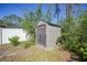 Storage shed in a backyard, with ample space for storing tools and outdoor equipment at 1406 Woodcrest, North Port, FL 34286