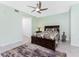 Primary bedroom featuring a queen-size bed, bedside tables and a window at 14281 Heritage Landing Blvd # 1411, Punta Gorda, FL 33955