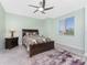 Primary bedroom featuring a queen-size bed, bedside tables and a window at 14281 Heritage Landing Blvd # 1411, Punta Gorda, FL 33955
