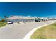 Condo garage fronts with paver driveway and green grass at 14281 Heritage Landing Blvd # 1411, Punta Gorda, FL 33955