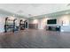 Interior of the gym room featuring training equipment, laminate flooring, a TV, and recessed lighting at 14281 Heritage Landing Blvd # 1411, Punta Gorda, FL 33955