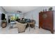 Living room with stylish furniture, tile floors, a ceiling fan, and sliding glass doors at 14281 Heritage Landing Blvd # 1411, Punta Gorda, FL 33955