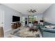 Comfortable living room with large TV, modern furniture, and access to outdoor screened patio at 14281 Heritage Landing Blvd # 1411, Punta Gorda, FL 33955