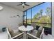 Outdoor patio with seating area and views of the surrounding greenery at 14281 Heritage Landing Blvd # 1411, Punta Gorda, FL 33955