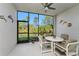 Outdoor patio with seating area, surrounded by screen and views of landscape at 14281 Heritage Landing Blvd # 1411, Punta Gorda, FL 33955